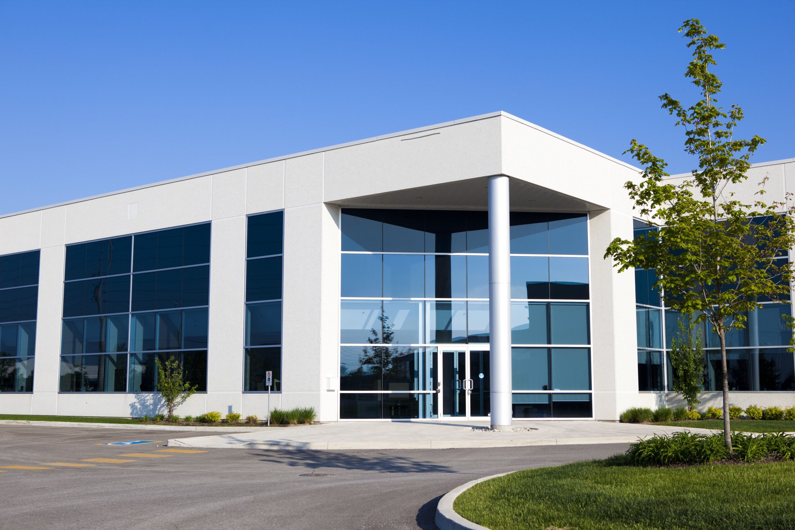 Modern commercial building with large windows and potential for professional window tinting.
